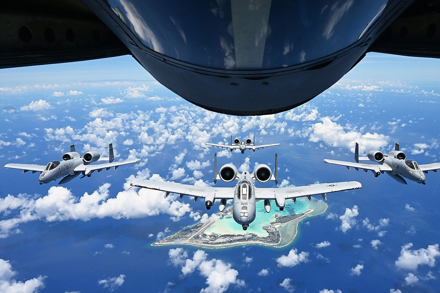 U.S. Air Force A-10 Thunderbolt II from the 25th Fighter Squadron , Osan Air Force Base, South Korea, fly in formation over Wake Island , June 7, 2025. The A-10 is a twin-engine, straight-wing, subsonic attack aircraft designed for close air support that has been flying for over 53 years. (U.S. Air Force photo by Senior Airman Audree Campbell)