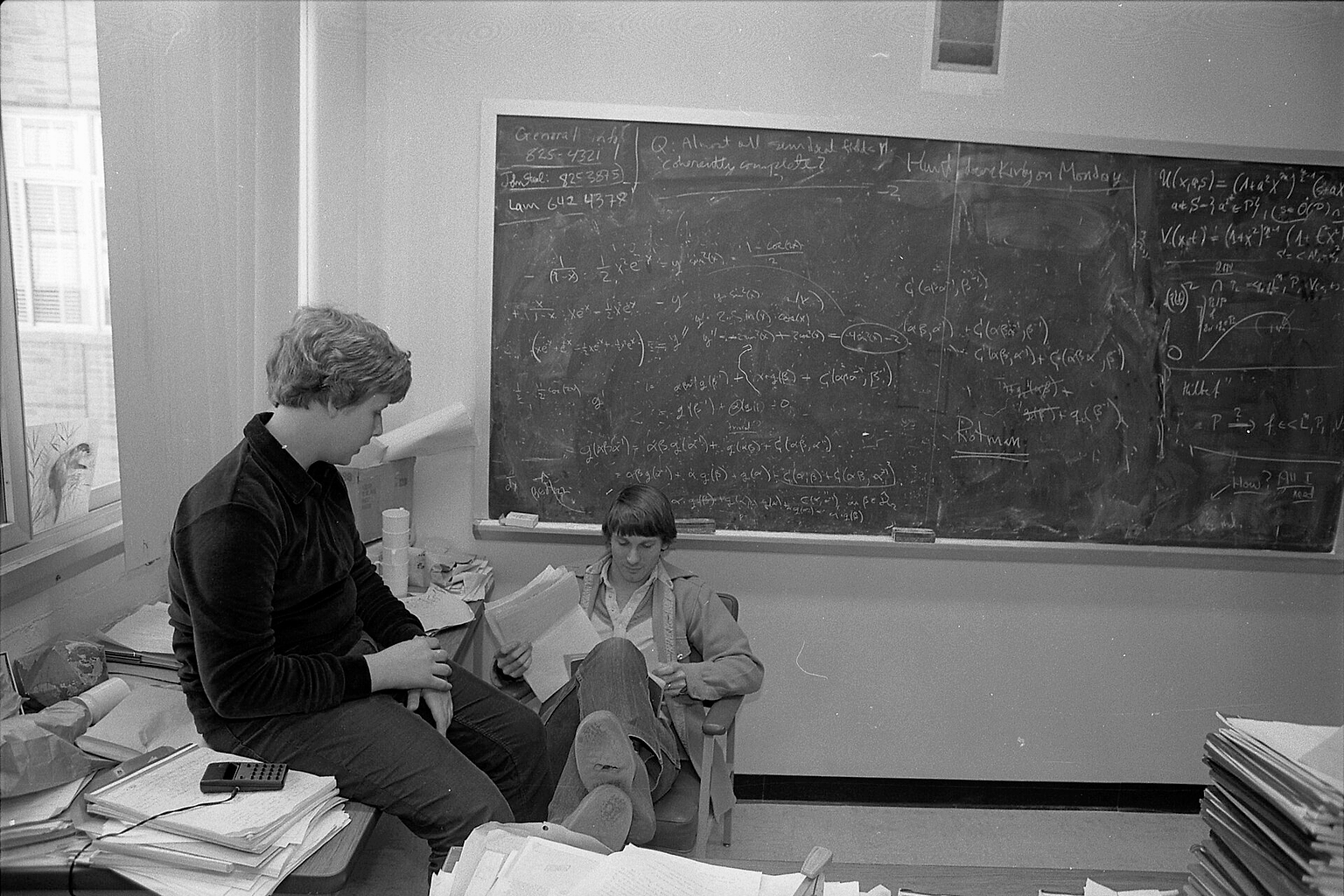 Twelve-year-old Eugene Volokh (left), a sophomore at UCLA, discusses his math final with Prof. William Jacob. "It is sort of intimidating, yes, being among people who are 11/2 times as old as you are," Volokh says. "But the benefits definitely outweigh the risks."