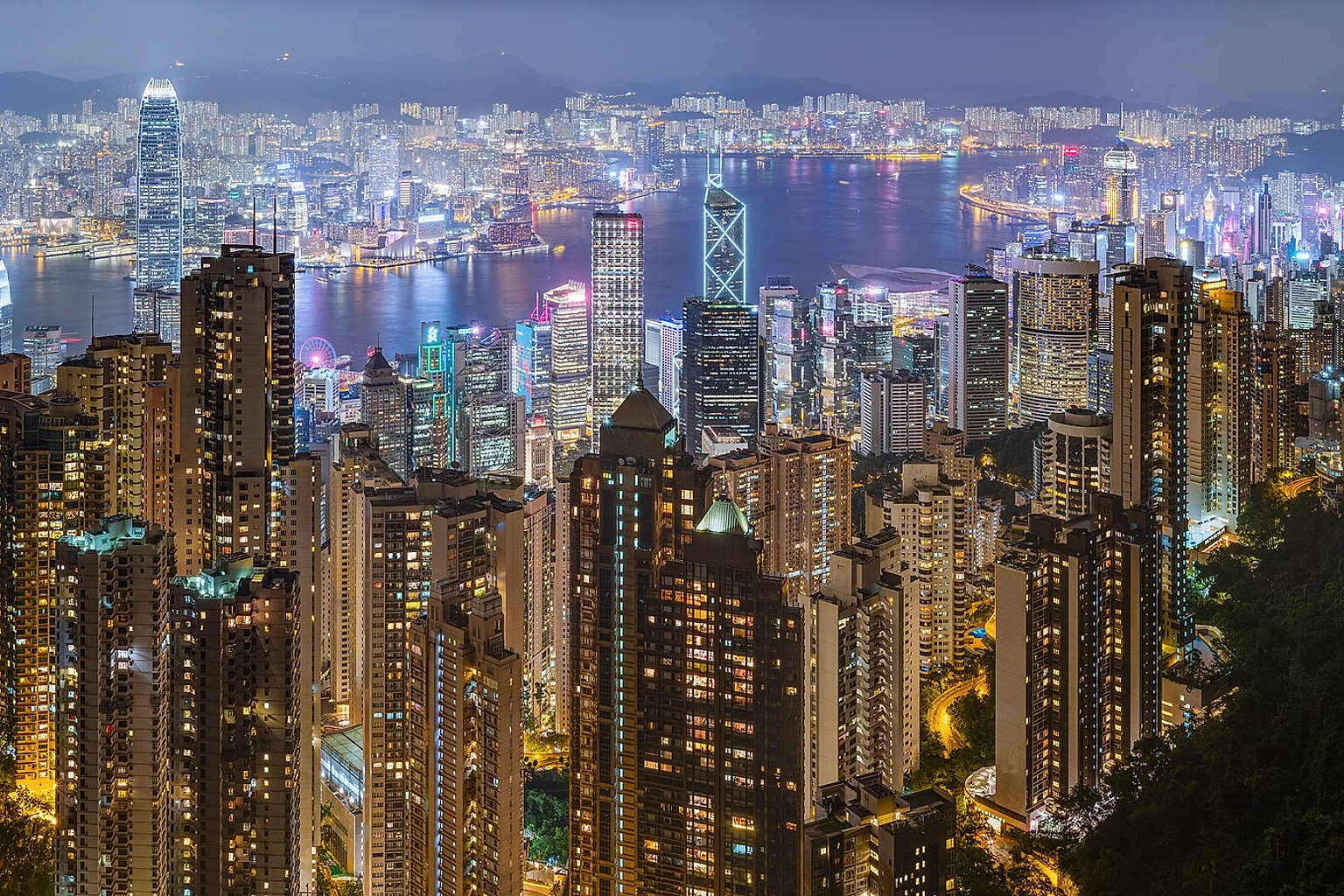 50 mpix panorama of Hong Kong's harbour and skyline, as seen from Victoria Peak on a rainy night of June 2019.
