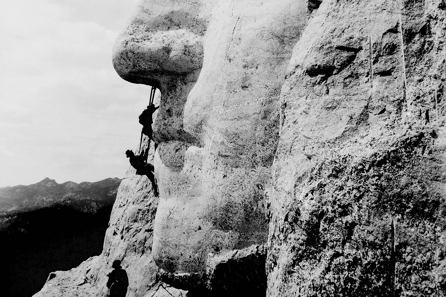 Construction at Mount Rushmore of George Washington's likeness.