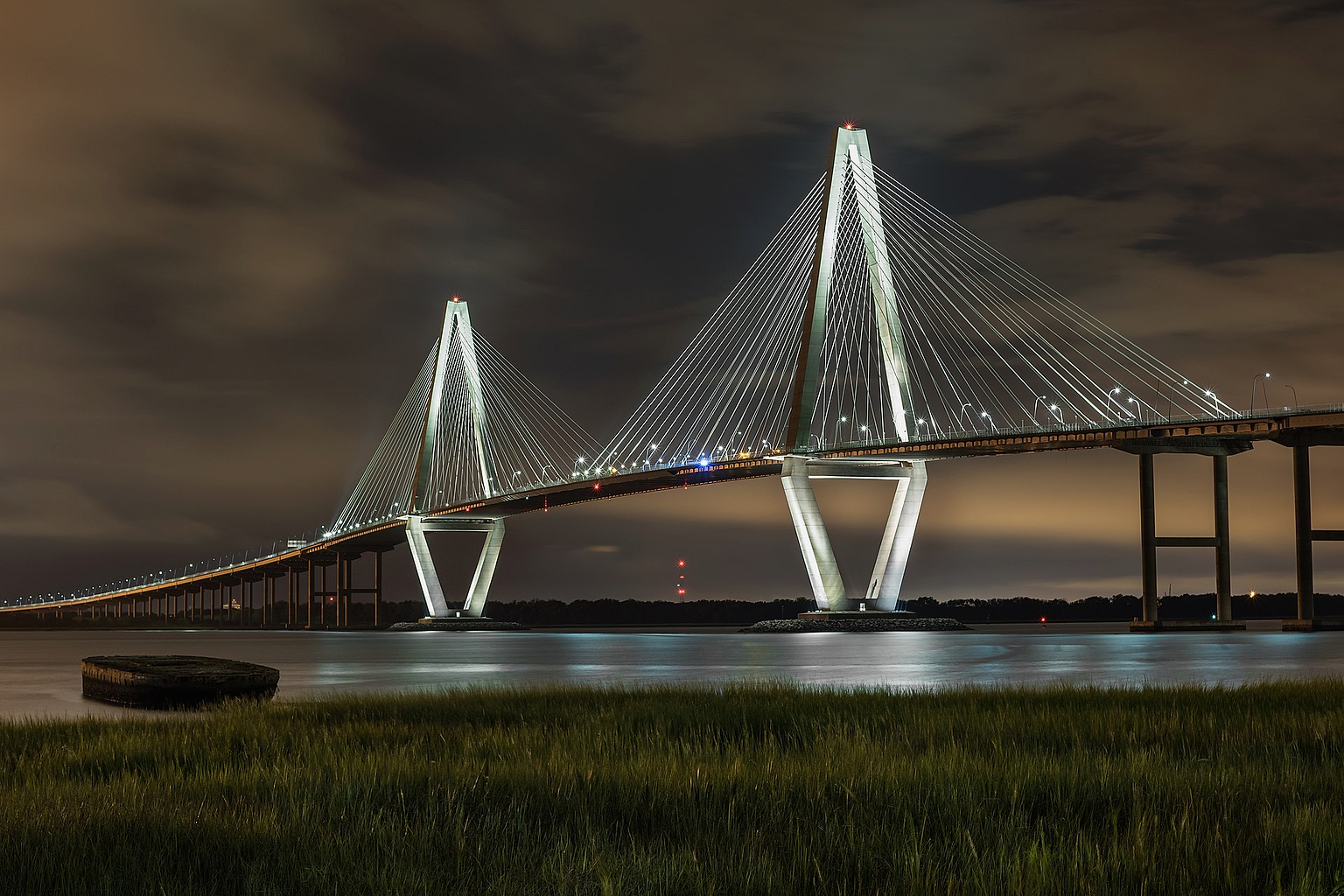 Arthur Ravenel Jr. Bridge (also known as the Cooper River Bridge) at night, looking northwest from Mount Pleasant, South Carolina .