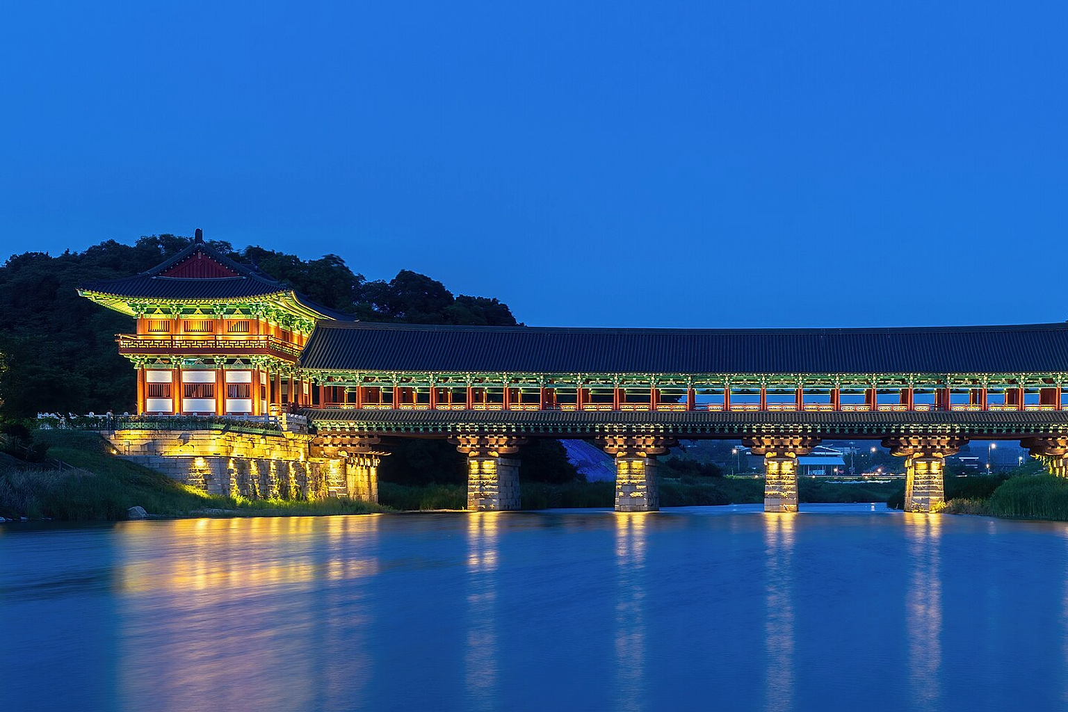 Illuminated Woljeonggyo Bridge at blue hour , in Gyeongju , South Korea .