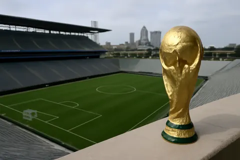 Grounded editorial scene illustrating Coverage of the 29th day of the FIFA World Cup 2026, encompassing global events and matches.