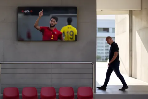 Grounded editorial scene illustrating Spain secured a dramatic 2-1 victory over Belgium in the World Cup quarter-finals, setting up a semi-final clash with France. Meanwhile, other major sports events unfolded across Europe.