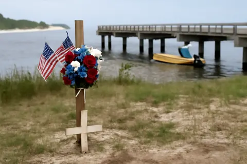 Grounded editorial scene illustrating The body of 18-year-old Nolan Wells was found on Horn Island after a Fourth of July trip with friends, prompting questions and an independent investigation.