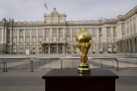 Grounded editorial scene illustrating Spain's national football team received a royal welcome and a massive fan parade in Madrid following their 2026 World Cup victory.