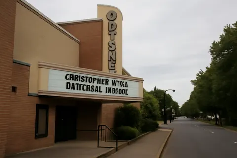 Grounded editorial scene illustrating A Lake Oswego theater's marquee promoting Christopher Nolan's 'The Odyssey' drew criticism for a message deemed historically inaccurate and antisemitic by some community members.