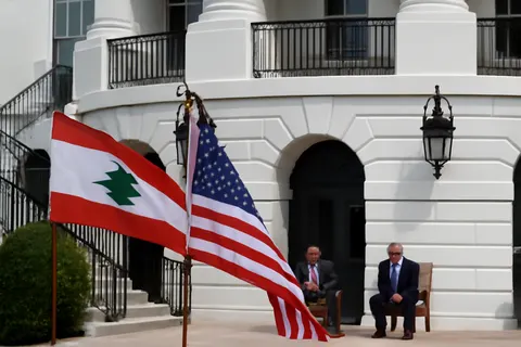 Grounded editorial scene illustrating Lebanese President Michel Aoun met with US President Donald Trump at the White House to discuss issues related to Hezbollah.