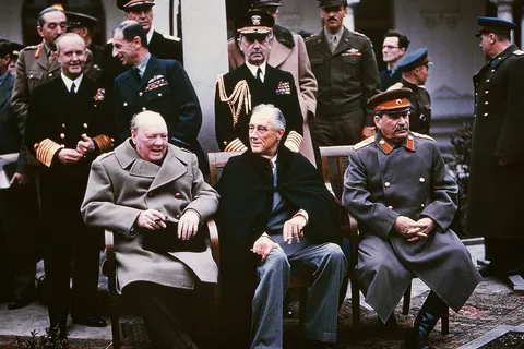 Yalta summit in February 1945 with (from left to right) Winston Churchill , Franklin Roosevelt and Joseph Stalin . Also present are USSR Foreign Minister Vyacheslav Molotov (far right); Field Marshal Alan Brooke , Admiral of the Fleet Sir Andrew Cunningham, RN , Marshal of the RAF Sir Charles Portal , (standing behind Churchill); George Marshall, Army Chief of Staff and Fleet Admiral William D. Leahy, USN , (standing behind Roosevelt).