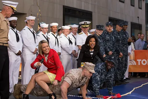 150523-M-TV331-061 Cpl. Stephen Hardcastle, a Marine with Special-Purpose Marine Air Ground Task Force-New York from Santa Fe, Texas, shows his strength prior to the tug-of-war event on the "Today" show as a part of Fleet Week New York, New York City, May 23, 2015. Marines with SP-MAGTF-NY showcase the capabilities of the Marine Corps both physically, mentally and technologically during Fleet Week New York. Fleet Week is an annual event that provides New York and surrounding area a chance to see the sea services capabilities. (U.S. Marine Corps photo by Cpl. Justin T. Updegraff/ Released) Note: Today show meteorologist Dylan Dreyer is wearing the ref jacket and Sheinelle Jones is wearing the black one.