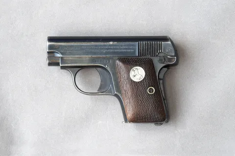 Colt 1908 .25 ACP S/n 408055 left side. Made c. 1940. Located Sykesville, MD. 2013. This 408nnn sample is a gun that has seen a lot of holster and carry wear but remains clean mechanically: the safety and lock-open lever and the notches into which it fits, are clean and tidy. The skin of the gun is clean. See also file of right side.
