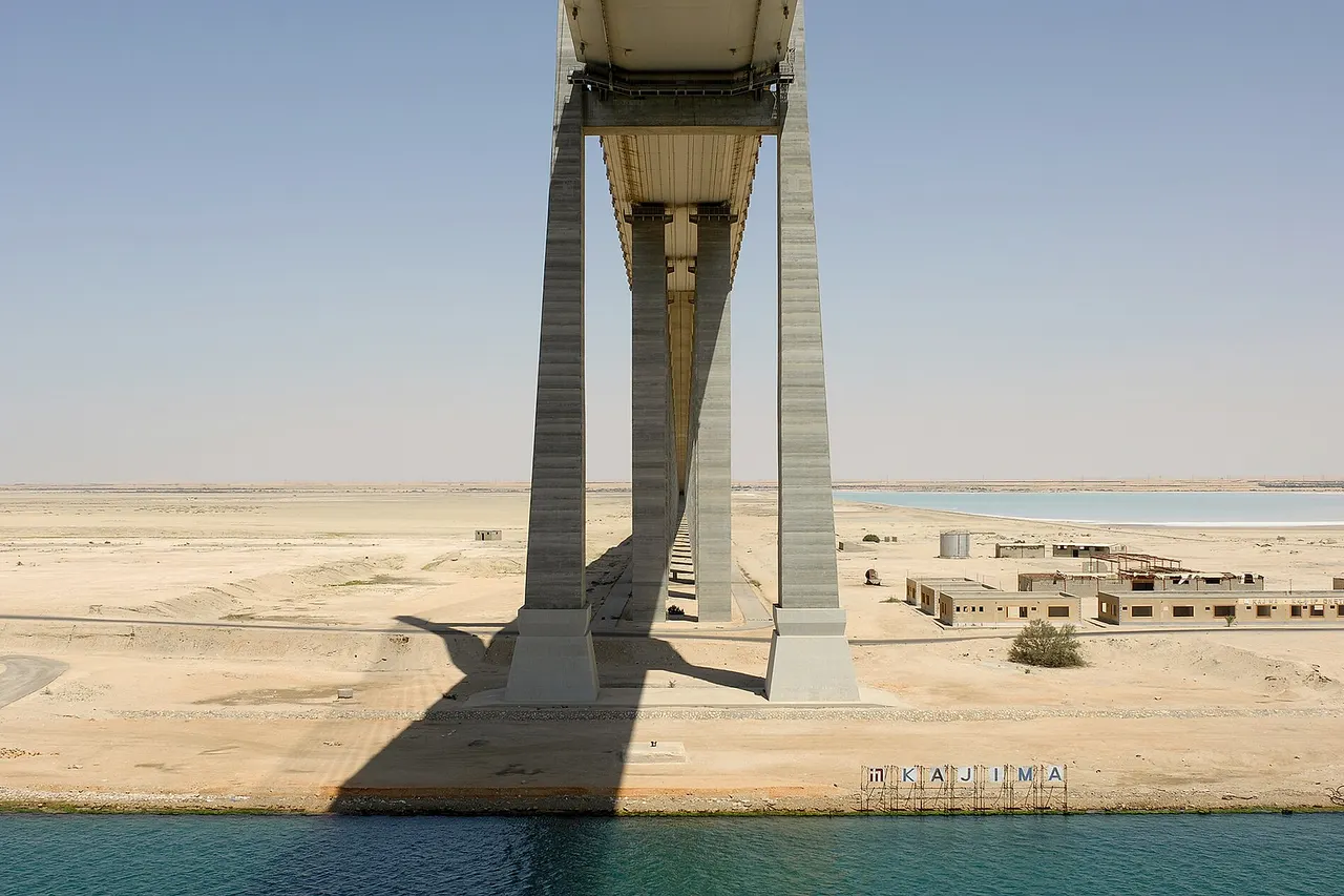 The Suez Canal Bridge crosses the Canal at El Qantara . It is also known as the Shohada 25 January Bridge or the Egyptian-Japanese Friendship Bridge .