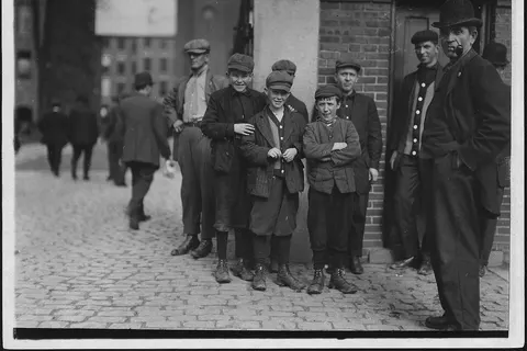 Workers in Merrimac Mill. Robert, smallest, 12 years old. Michael Keefe, next in size, about 13 or 14 years old. Cornelius Hurley, about 13 or 14. S. Framingham, Mass.