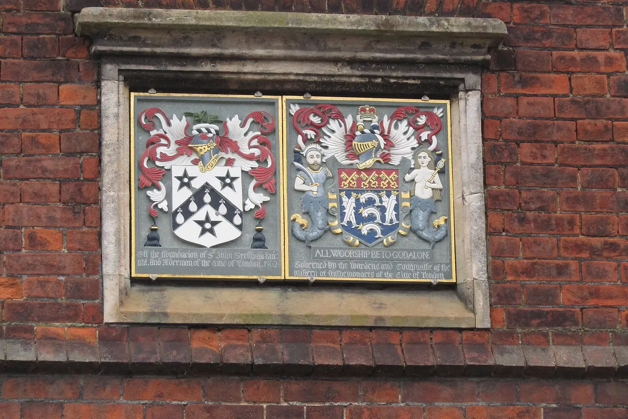 The two Coat of Arms above theentrance to Gresham's Pre-Prep school located in Station Road within the town of Holt in the English county of Norfolk in England.