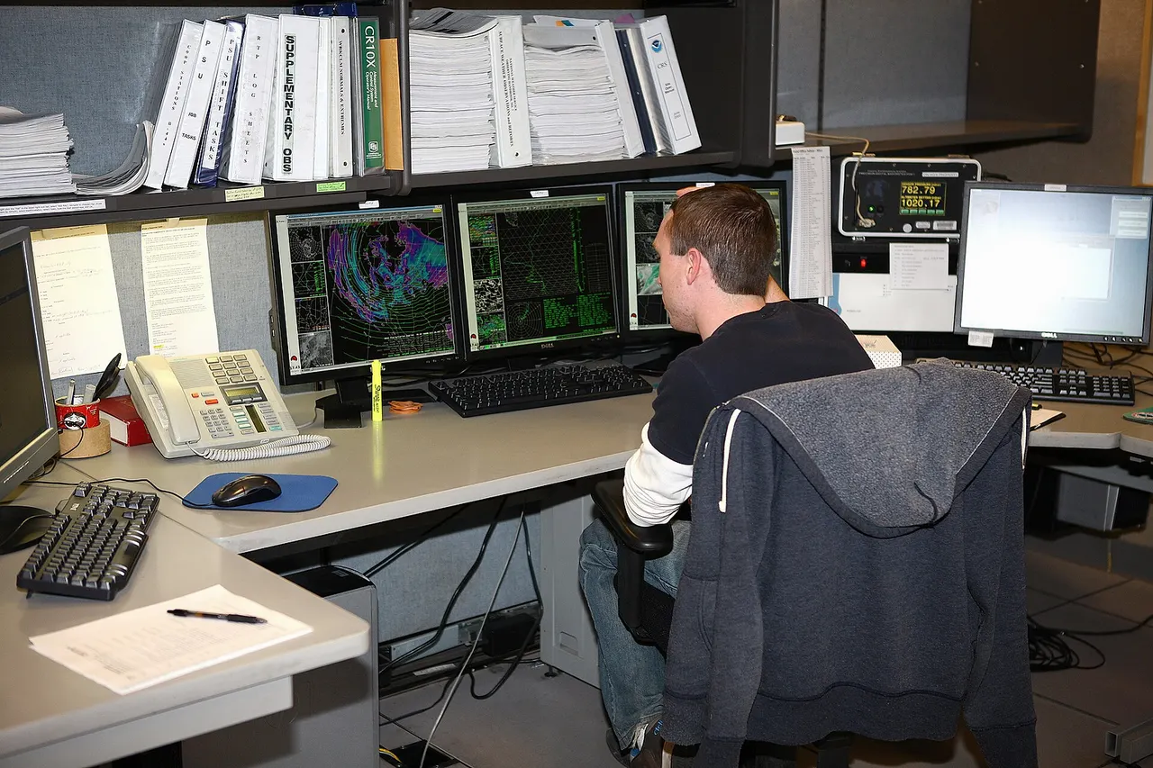 A meteorologist at the National Weather Service Operations Center in Flagstaff, analyzes data on an upcoming snow storm. The forecast they generate will give area residents an accurate estimate of when the storm will hit, and how much snow can be expected.