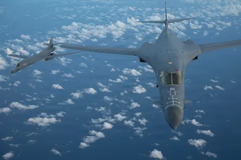 Two U.S. Air Force B-1B Lancer bombers fly in formation during an Operation SOUTHERN SPEAR mission over the U.S. Southern Command area of responsibility Oct. 27, 2025. These operations underscore the U.S. commitment to safeguarding the homeland, deterring aggression, and reassuring regional partners. (U.S. Air Force photo by Staff Sgt. Gerald R. Willis)