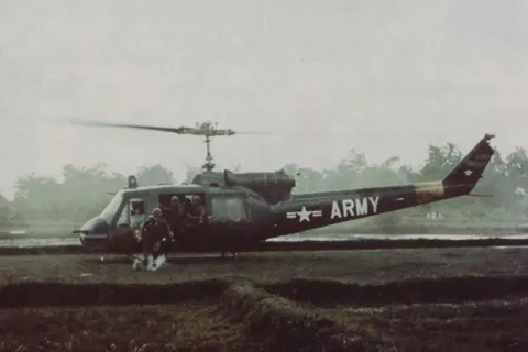 Soldiers scramble from a UH-1B helicopter during a search and destroy mission NARA 111-CCV-95-CC31455
