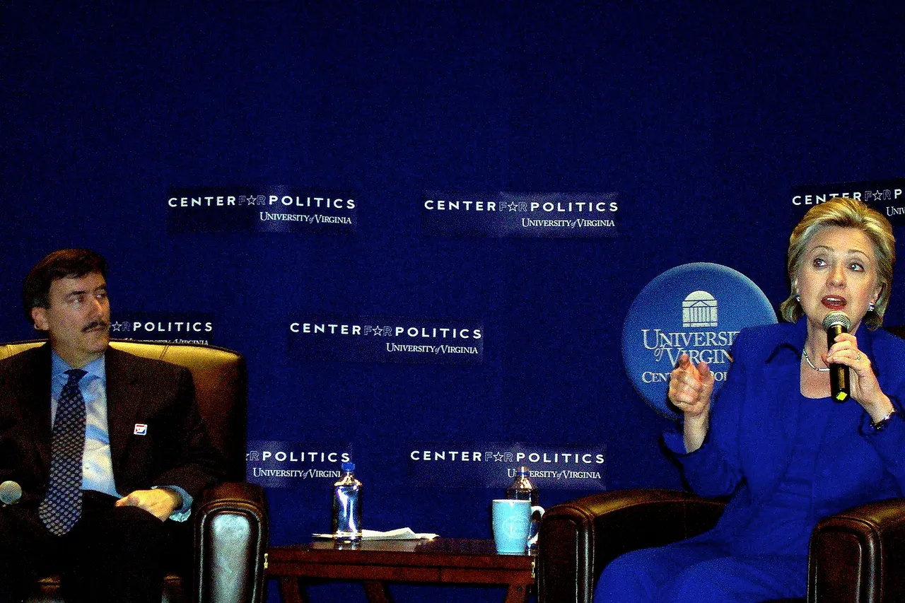 Political pundit and University of Virginia professor Larry Sabato watches as his guest lecturer, US Senator and 2008 Democratic presidential candidate Hillary Clinton , speaks to his American Politics 101 class at UVA.