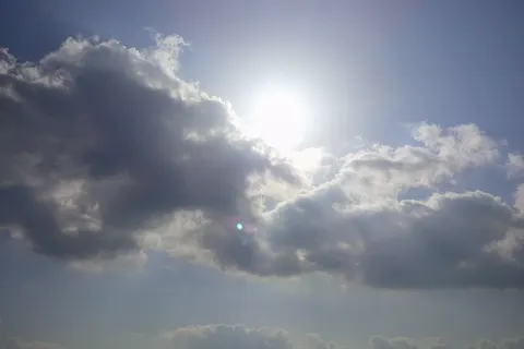sun behind the clouds on punjab village
