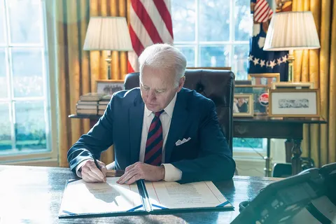 President Joe Biden signs H.R. 6256, an act “to ensure that goods made with forced labor in the Xinjiang Uyghur Autonomous Region of the People’s Republic of China do not enter the United States market, and for other purposes”, Thursday, December 23, 2021, in the Oval Office of the White House. (Official White House Photo by Adam Schultz)