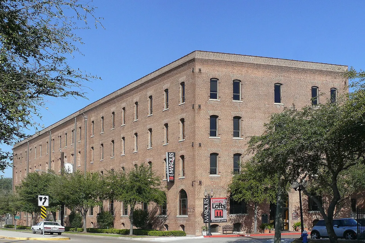 The City of Houston developed rapidly in the 19th century due in large part to its capacity for shipping and transportation. This was made possible by waterways, such as Buffalo Bayou, and railroads, five of which radiated from the city in 1861. Houston's industrial center, the warehouse district, grew up east of Main Street, along the banks of Buffalo Bayou. In 1860, Samuel May Williams sold this property to Houston physician D.F. Stuart, who built a warehouse in the 1880s for cotton storage. The Lottman brothers purchased the site in 1893 and converted the building into a mattress factory. In 1904, they sold the property to H.F. Spalti, vice-president of Olive & Myers Manufacturing Company of Dallas. Spalti and Company President W.B. Myers started Myers-Spalti on this site. J.A. Grieves assisted them in developing the Houston branch of their successful mattress and furniture factory. The original warehouse housed the millwork and planning sections of the company. Built in 1905, Warehouse Number Two housed the shipping, cabinetry and finishing departments, and Warehouse Number Three contained the printing and management offices. By 1907, a rail line extended onto the property from nearby tracks. Myers-Spalti added a fourth warehouse for storage in 1909 and additional structures in the 1920s. The company moved operations in the 1950s. The development of Houston's industrial architecture can be seen in this site's building styles, which range from brick and heavy timber to concrete slab and columns. Since the 1950s, the buildings have housed hardware sales, electronics and manufacturing, storage and other light industrial businesses. The structures were once part of a city marketplace project and later developed into residential housing. Location 29° 45.612? N, 95° 20.815?