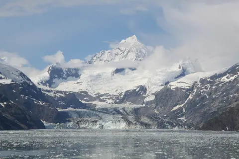 John Hopkins Glacier with Mount Orville and Mount Wilbur behind it, as seen from Glacier Bay in 2014.