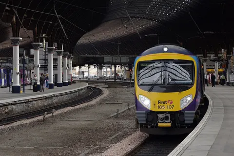 First TransPennine Express Desiro DMU 185107 at York with a service to Manchester Airport.