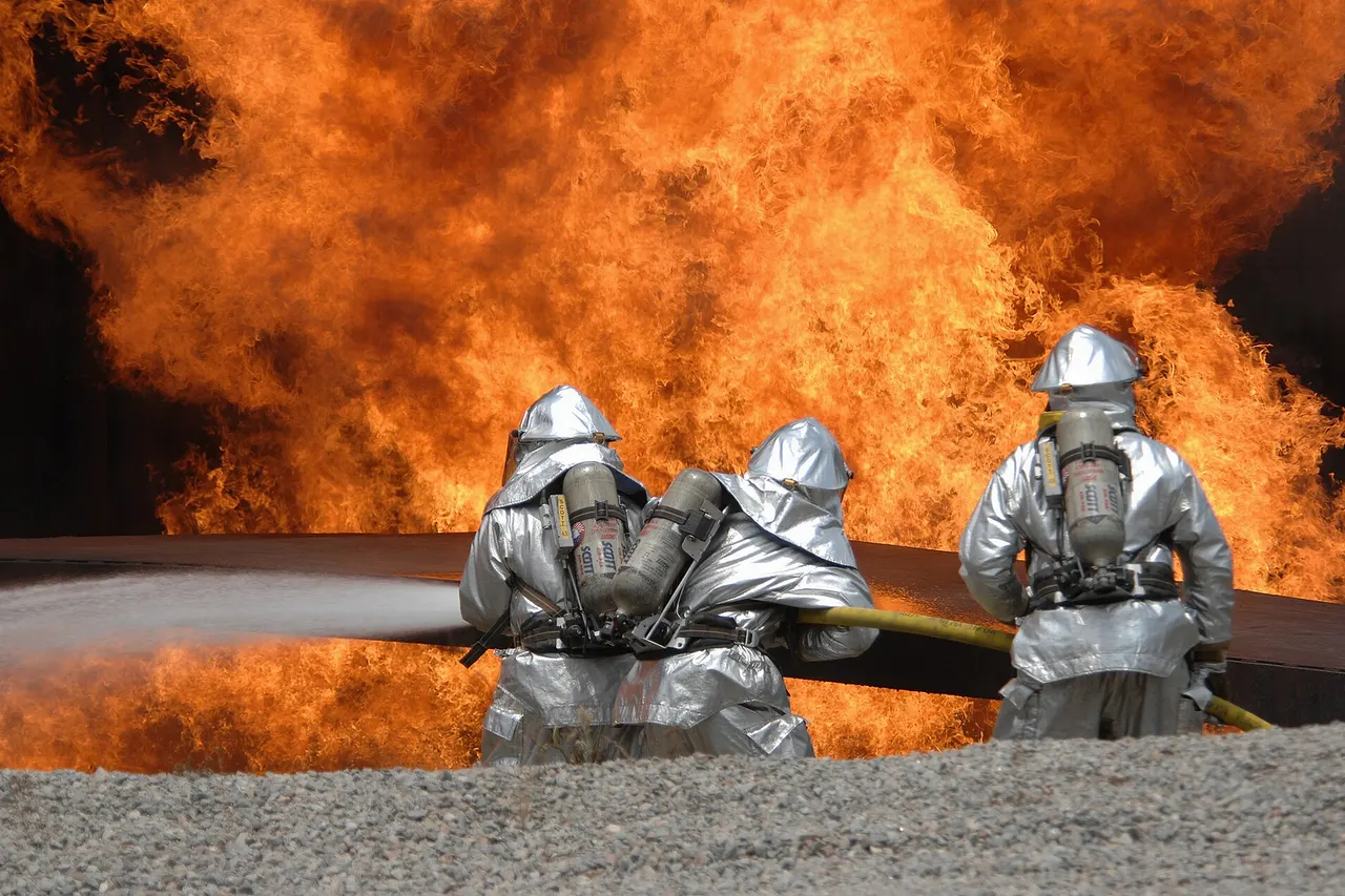 United States Air Force Airmen from the 20th Civil Engineer Squadron Fire Protection Flight neutralize a live fire during a field training exercise at Shaw Air Force Base in South Carolina May 23, 2007. The exercise includes training in self-aid buddy care, expedient firefighting, weapons handling, and night-vision devices.
