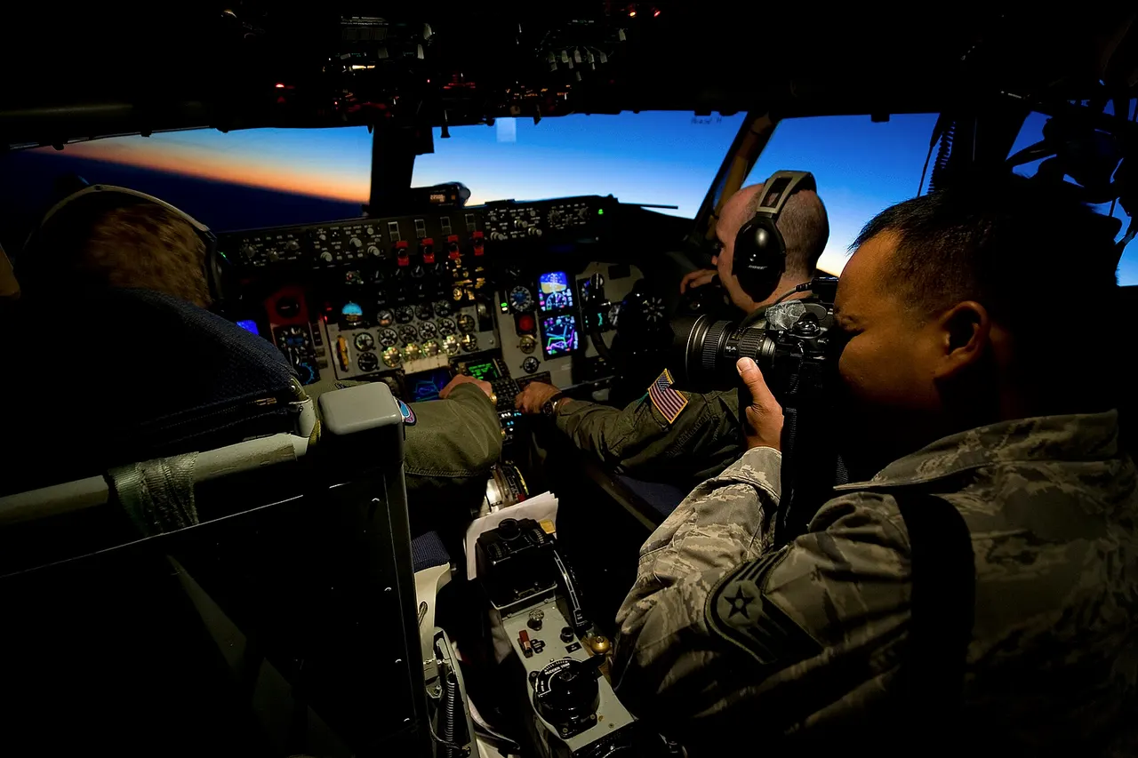U.S. Air Force Staff Sgt. Chris Hubenthal , 99th Air Base Wing Public Affairs photojournalist , documents Selfridge Air National Guardsmen inside a KC-135 Stratotanker during Green Flag-West 11 -9 Aug. 16, 2011, over the National Training Center at Fort Irwin, Calif. Green Flag-West provides a realistic close-air support training environment for forces preparing to support worldwide combat operations. ( U.S. Air Force photo by Senior Airman Brett Clashman/Released)