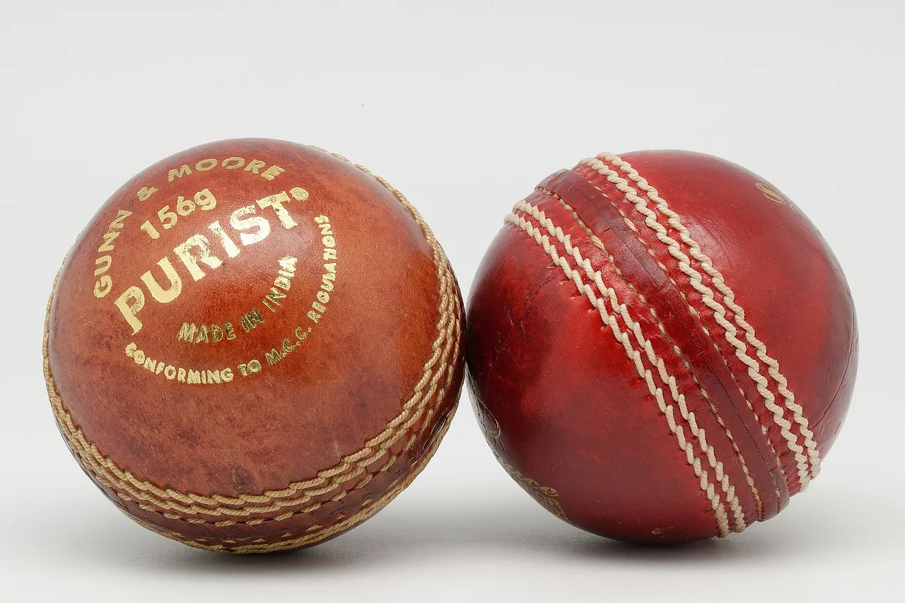 A Gunn & Moore Purist 156g (left) and a Grace match ball junior (right) cricket balls.