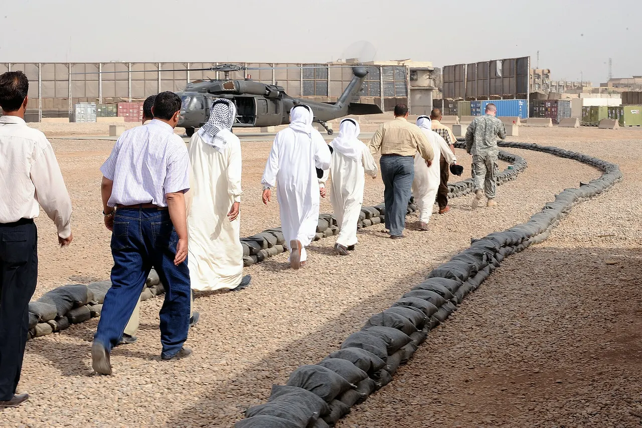 Participants in a meeting between the Sunni organization Sahwa, and Iraqi national police leaders, prepare to board a UH-60 Blackhawk helicopter, at Joint Security Station Loyalty, eastern Baghdad, Iraq, on May 16. The meeting was held to discuss the future of the Sons of Iraq and other issues of concern.