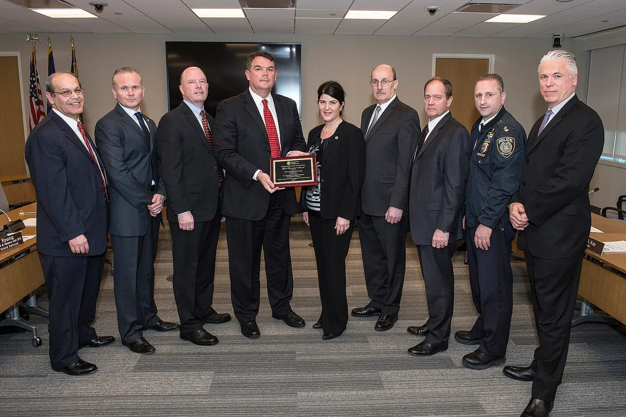 Long Island Rail Road and MTA PD receive a TSA Gold Standard award -- the highest rating for transportation security efforts. Award was presented at the MTA's Long Island Rail Road Committee Meeting on Monday, March 23, 2015. Fr. l to r: Ronald Masciana, (TSA), James FitzGerald, (TSA), Philip Salmon (TSA), David Kubicek (VP LIRR) Marisa Maola (TSA), Raymond Diaz (MTA) Robert Murphy (LIRR), Assistant Chief Thomas Odessa (MTAPD), Chief Michael Coan (MTAPD)., Photo: Metropolitan Transportation Authority / Patrick Cashin