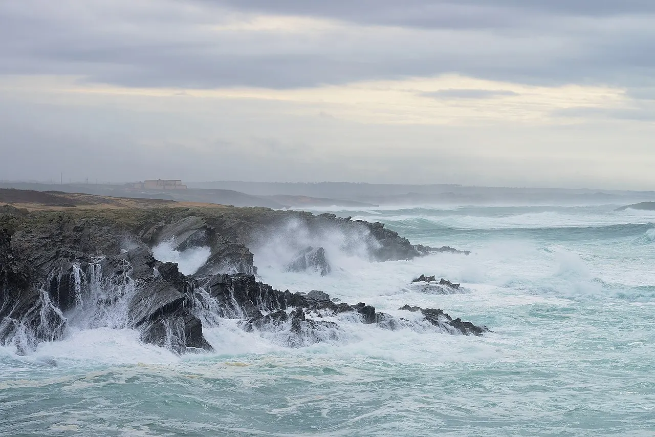 Surf and foam in a stormy sea during calm weather. Porto Covo, Portugal