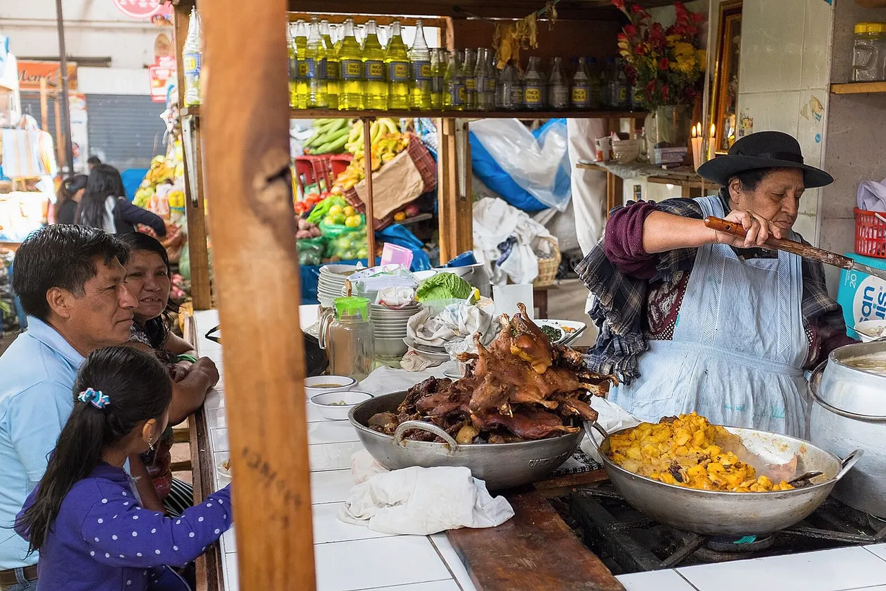 At the food market of Cajamarca, Peru, a family waits for its lunch to be served. This stand displays the local specialty: guinea pigs.