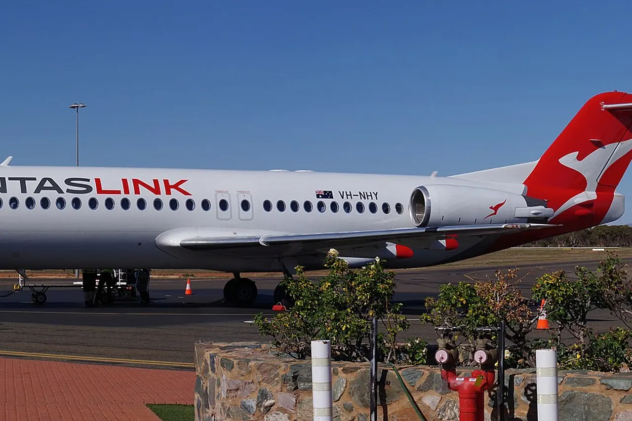 QantasLink Fokker 100 VH-NHY regional jet at Kalgoorlie-Boulder Airport, Western Australia, on 04 August 2019.