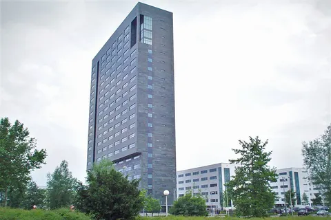 Corporate headquarters of ASML (NASDAQ:ASMLD), a supplier of lithography systems for the semiconductor industry. The office building is 82 metres tall and located in Veldhoven, Netherlands.