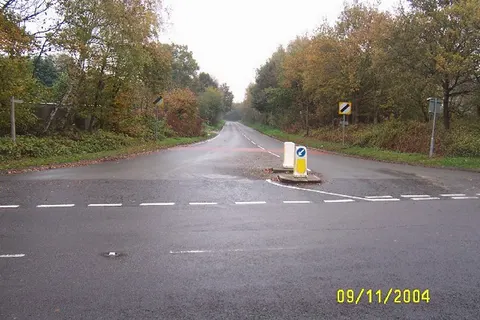Trumps Green, Bridge Lane. Viewed looking south-eastwards from its junction with Trumpsgreen Road, Bridge Lane is intriguingly not shown at all on the OS 1940s map.