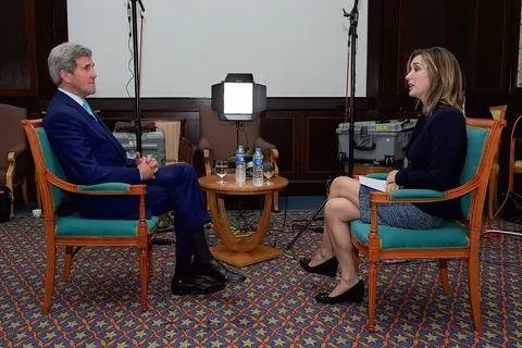 U.S. Secretary of State John Kerry sits with CBS News State Department Correspondent Margaret Brennan in Sharm el-Sheikh, Egypt, on March 14, 2015, following an interview focused on his upcoming negotiations with Iran over its nuclear program, as well as other foreign policy topics. [State Department Photo/Public Domain]