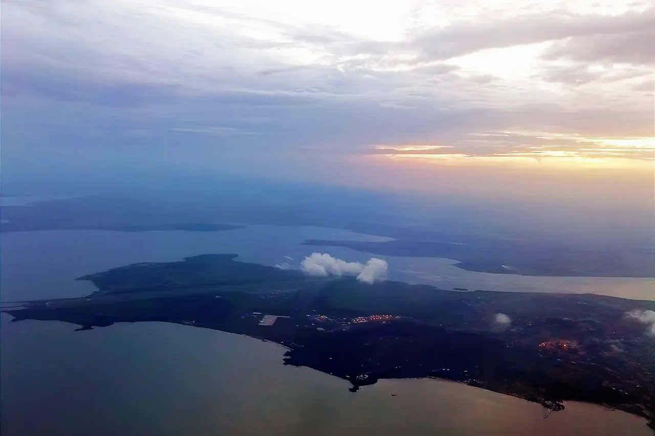 Aerial shot of the city of Entebbe and Entebbe International Airport in sunset.