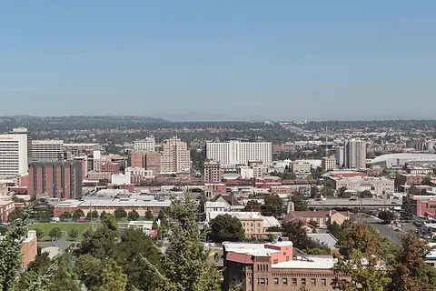 A panoramic view of the skyline of Spokane , the second largest city in the state of Washington, as seen from above Edwidge Woldson Park.