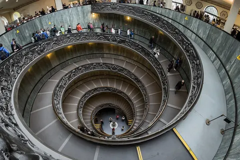 The double spiral staircase designed by Giuseppe Momo, sculpted by Antonio Maraini and realized by the Ferdinando Marinelli Artistic Foundry for the Vatican Museums 1932. This image was taken with a Samyang 8mm fisheye lens at f8, 0.25s, ISO 800.