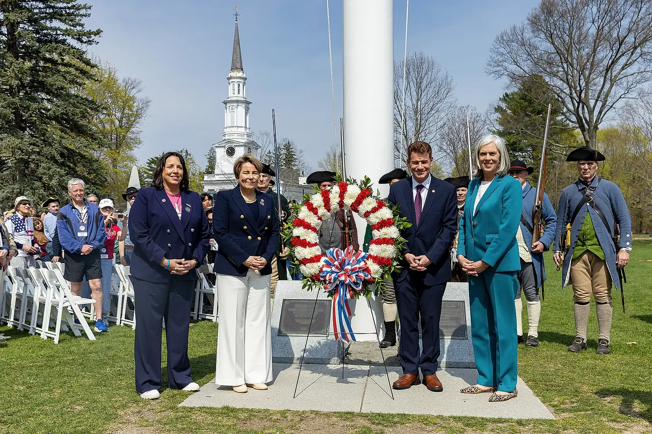 "Governor Maura Healey and Lt. Governor Kim Driscoll join U.S. Army Brigadier General Mark Lalin and U.S. Air Force Major General Gary W. Keefe, adjutant general of the Massachusetts National Guard, and America 250 Chair Rosie Rios, as well as local legislators and officials, to rededicate the Lexington Battle Green in honor of the revolutionary Battle of Lexington on April 19th, 2025."