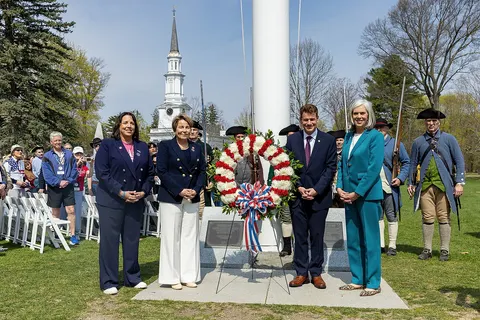 "Governor Maura Healey and Lt. Governor Kim Driscoll join U.S. Army Brigadier General Mark Lalin and U.S. Air Force Major General Gary W. Keefe, adjutant general of the Massachusetts National Guard, and America 250 Chair Rosie Rios, as well as local legislators and officials, to rededicate the Lexington Battle Green in honor of the revolutionary Battle of Lexington on April 19th, 2025."