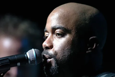 Darius Rucker, lead singer of Hootie and the Blowfish, sings to a crowd during an Operation Pacific Greetings tour concert