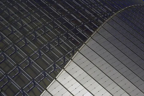 Detail of the National Grand Theatre in Beijing, China. Transition from glass to titanium portion of roof.