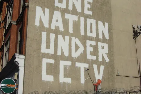 One nation under CCTV, Newman Street, London. By pseudo-anonymous, British graffiti artist Banksy