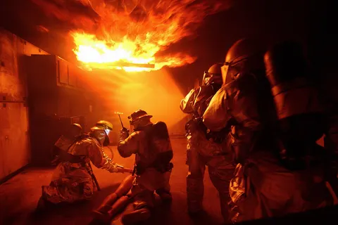 When you're hot, you're hot! Airmen from the 18th Civil Engineer Squadron Fire Department conduct training at the Silver Flag area of Kadena Air Base, Japan, Dec. 2 during Beverly High 09-01, a local operational readiness exercise to test the readiness of Kadena's 18th Wing Airmen. (U.S. Air Force photo/Tech. Sgt. Rey Ramon)