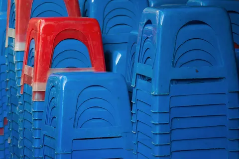 Hanoi, Vietnam: Asia's omnipresent style of plastic stools, stacked in front of a restaurant.