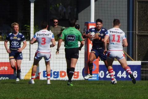 St George Illawarra Dragons and North Queensland Cowboys players competing in the second NRL game to be played in the regional Australian city of Rockhampton, Queensland on 28 August 2021. The North Queensland Cowboys won the match 38-26. The game attracted a crowd of 4,487. The Round 24 game was the second of two NRL games played in Rockhampton over two consecutive weeks with the attendance boosted by the presence of a Queensland-based team. (1,624 more people attended the second game compared to the previous week's game at Browne Park between Wests Tigers and Cronulla Sharks.)
