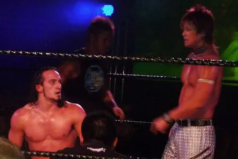 PAC (left), Susumu Yokosuka (centre), and BxB Hulk (right) at a Dragon Gate show in Oxford in November 2009.